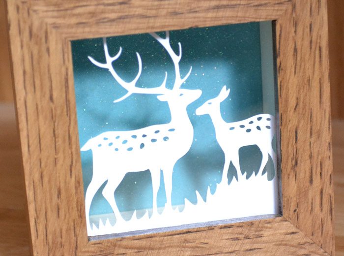 deep oak framed paper cut